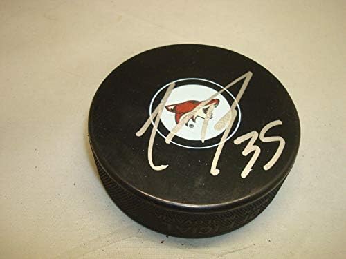 Louis Domingue assinou o Arizona Coyotes Hockey Puck autografado 1F - Pucks autografados da NHL